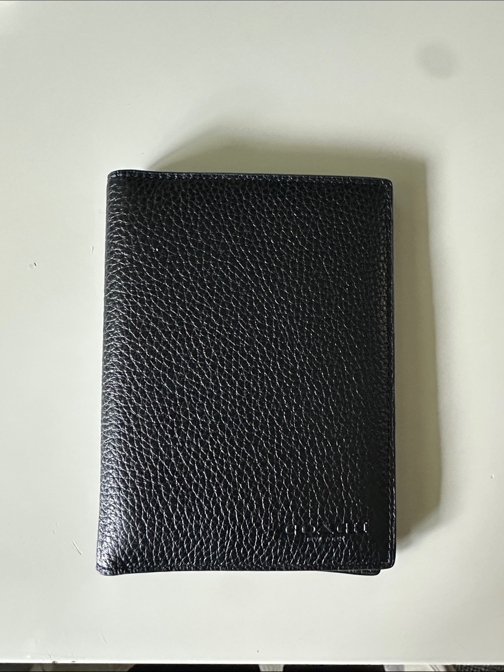 Coach black pebbled, leather passport holder
